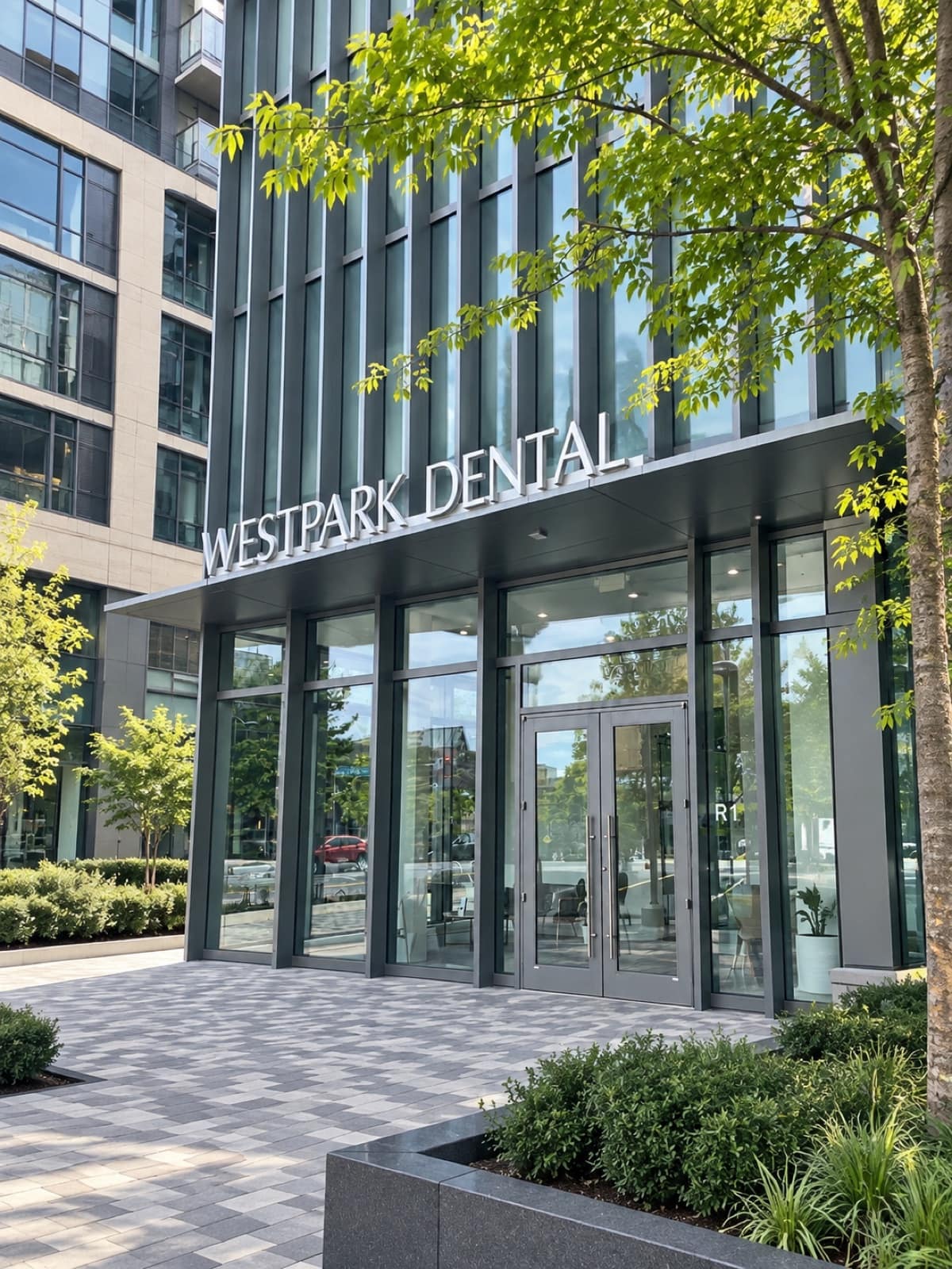 Exterior entrance of Westpark Dental Studio, with WESTPARK DENTAL signage above glass doors in the Westpark neighborhood of McLean, Virginia